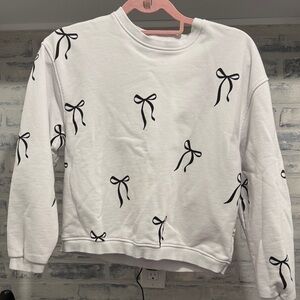 White Sweatshirt with Black Bow Design